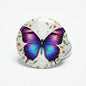2.25-inch butterfly pinback button with purple-blue wings and floral border