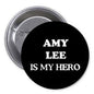 Black pinback button with 'AMY LEE IS MY HERO' text, round metal backing