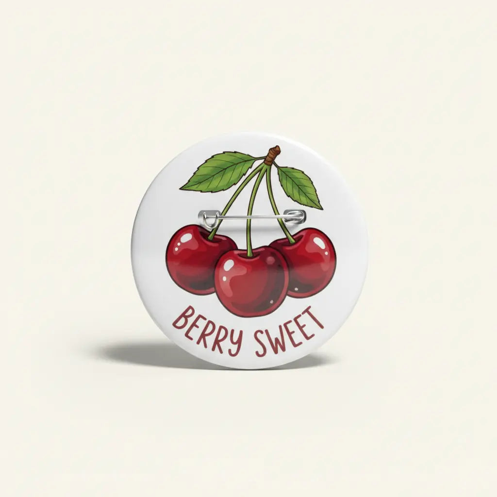 Cherry pinback button with red berries, green leaves, and “BERRY SWEET” text