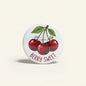 Cherry pinback button with red berries, green leaves, and “BERRY SWEET” text