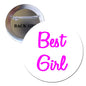 Round pinback button with pink “Best Girl” lettering and metal safety pin backing