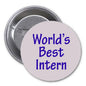 Round pinback button with 'World's Best Intern' text, metal clasp on back