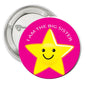 2.25-inch pinback badge, pink with yellow star face and “I AM THE BIG SISTER” text