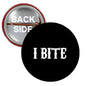 Black round pinback button with white "I BITE" text, smiling mouth graphic