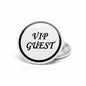 VIP guest pinback button with black rim; white face reads "VIP GUEST".