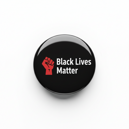 Round black enamel pin with red raised fist and “Black Lives Matter” text
