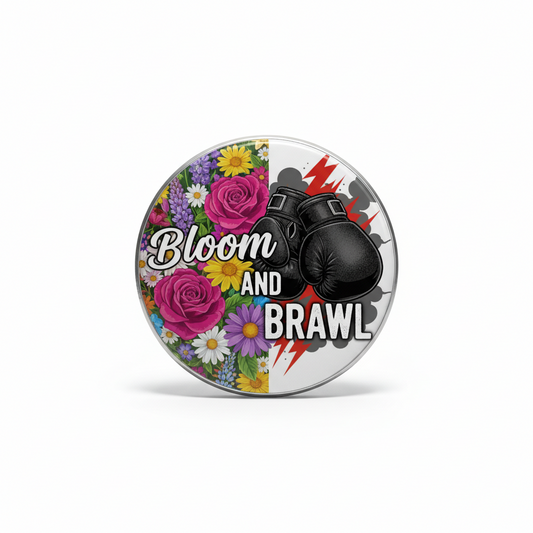 Bloom and Brawl pinback button, circular design with flowers and boxing gloves