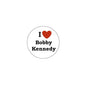 Round pinback button with red heart and text "I Bobby Kennedy"