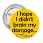 Yellow round pinback button with black quote text and cursive signature