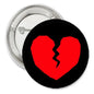 1.25-inch pinback button with black border and red broken heart graphic