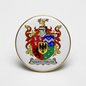Round gold-rim enamel coat of arms pinback with heraldic shield and motto text