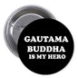 Round black button pin with white “GAUTAMA BUDDHA IS MY HERO” text and metal pin