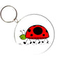 Round ladybug keychain with red-and-black beetle illustration and metal key ring