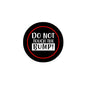 2.25-inch pinback button, round black with red ring and "DO NOT TOUCH THE BUMP!"