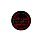 2.25-inch black pinback button with red "Be a bad ass with a good ass" text