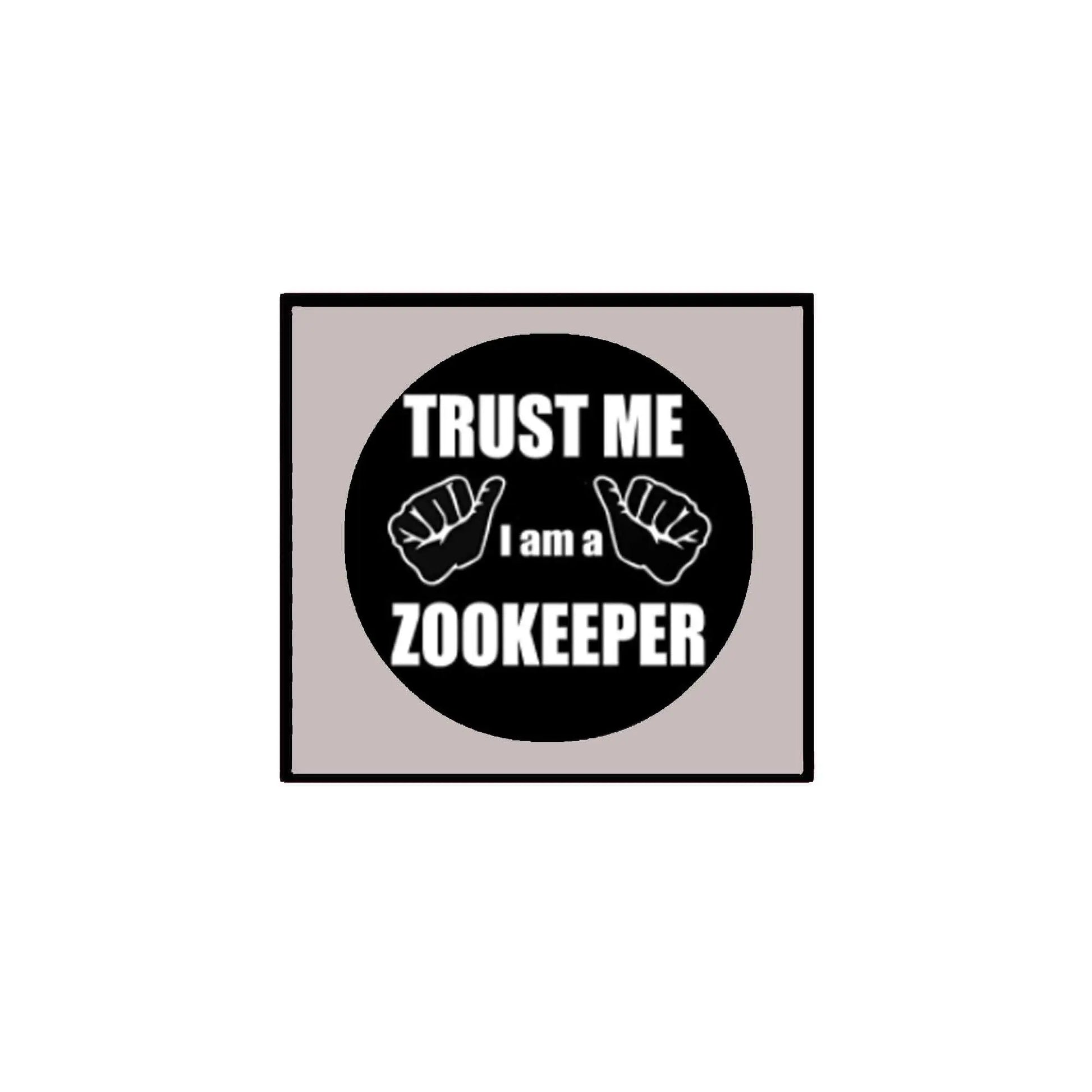 2.25-inch pinback button: black circle "TRUST ME I AM A ZOOKEEPER" with hands
