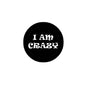2.25-inch round pinback badge, black with white 'I Am Crazy' text
