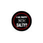 Round black pinback button with red border and text “I AM PRETTY” “SALTY?”