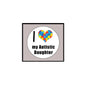 White circular pinback badge with multicolor puzzle heart and text "my Autistic Daughter"
