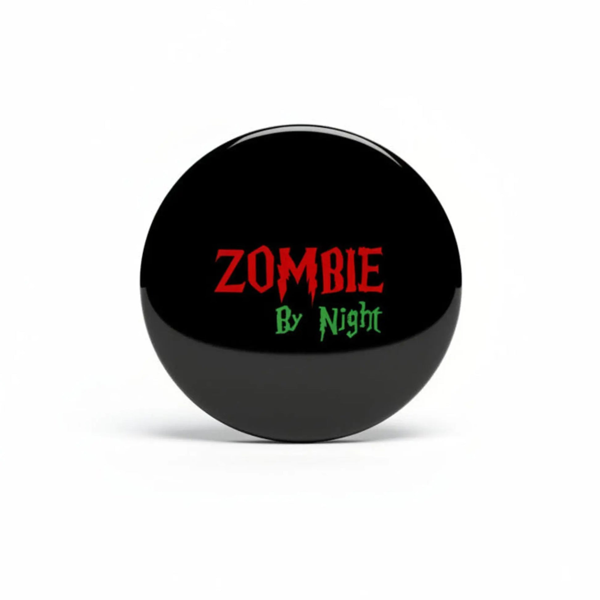 Black Zombie pinback badge with red “ZOMBIE” and green “By Night” text
