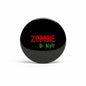 Black Zombie pinback badge with red “ZOMBIE” and green “By Night” text