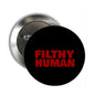 Round pinback button with red 'FILTHY HUMAN' text on black