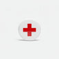 Round white pin badge with red cross