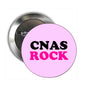 Round pinback button, pink face with “CNAs ROCK” text and silver metal back