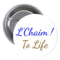 L'Chaim ! To Life pinback button, 1.25-inch; white with blue and brown script