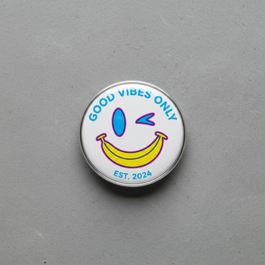 Circular badge with smiley face and 'Good Vibes Only' text on a gray background