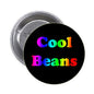 Round black pinback button with colorful “Cool Beans” text, metal backing