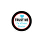 Round cruise director pinback button with “TRUST ME” text and heart icon, black border