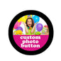 Round black pinback button with a colorful custom photo graphic of a smiling child