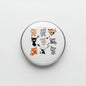 Round 2.25-inch cat pinback button with colorful cartoon cats on clear front