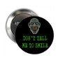 2.25-inch zombie pinback button, black with green 'DON'T TELL ME TO SMILE' text
