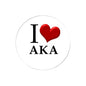 Round pinback button with I heart AKA text and red heart graphic