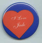 Round pinback button with blue rim, red heart, and “I Love Jade” cursive text