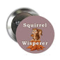 Round 2.25-inch metal pinback button with squirrel graphic and text 'Squirrel Whisperer'.
