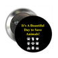Black pinback button with yellow 'Beautiful Day to Save Animals' text and paw prints