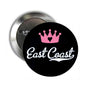 Black 2.25-inch pinback button with pink crown and white "East Coast" text