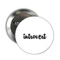 Introvert round pinback badge with black text on a white face