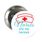 Nurse-themed circular pinback button with red medical cross and 'Nurses are my heroes'