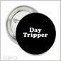 2.25-inch black pinback button with 'Day Tripper' white text