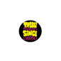 2.25-inch pinback button with black background and colorful 'Trouble maker since' text