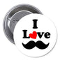 Round pinback button with black mustache, “I Love” text, and red heart graphic