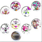 8 round Diddl character pinback buttons, showing fronts and a back side
