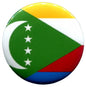 Circular Comoros flag pinback badge with green, white stars, yellow and red stripes.