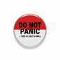 Red-and-white pinback button reading 'DO NOT PANIC—THIS IS JUST A DRILL'