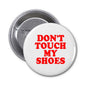 2.25-inch pinback button, white face with red “DON'T TOUCH MY SHOES” text