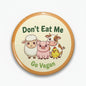 2.25-inch pinback button with Don't Eat Me Go Vegan text and farm animal cartoon